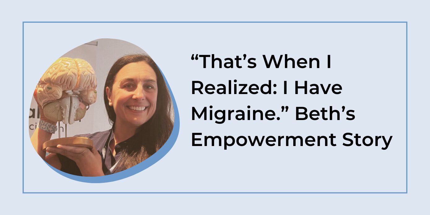 A woman smiles while holding a model of the human brain